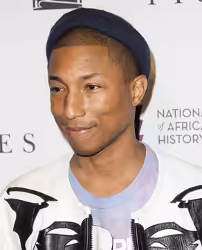 American singer-songwriter Pharrell Williams arrives on the red carpet for a screening of the film “Hidden Figures” at the Smithsonian’s National Museum of Afri