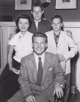 Publicity photo of American actors, (clockwise from front) Ozzie Nelson, Harriet Nelson, David Nelson and Ricky Nelson promoting their roles on the ABC televisi
