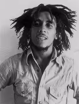 Bob Marley in a press photo dated to 1976. Photo was published by the US branch of Island Records. Newspaper clipping on back can be traced to the Feburary 08 1