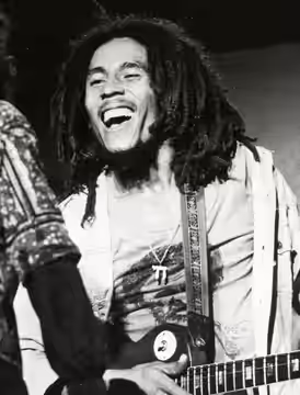 Bob Marley performing with Ziggy Marley in (according to this blog post) Boston on April 25, 1976. The photo was published in 1977 by the US branch of Island Re