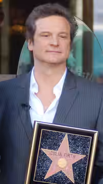 Tom Hooper and Colin Firth at a ceremony for Firth to receive a star on the Hollywood Walk of Fame. (2011)