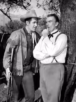 Photo of Sheb Wooley and guest star Walter Pidgeon from the television program Rawhide. (1962)