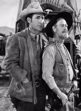 Photo of Sheb Wooley as Pete Nolan and Paul Brinegar as Wishbone from the Western television program Rawhide. Wooley was also a singer; The Purple People Eater  (1962)