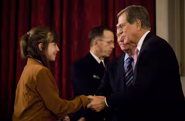 Republican U.S. Sens. Thad Cochran and Trent Lott, both of Mississippi, congratulate Helena Edge, daughter of U.S. Marine Capt. James Edge, after presenting her