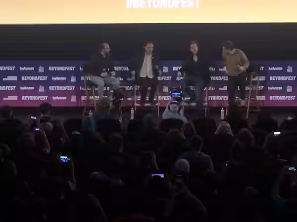 Nathan Fielder welcoming Tim Heidecker, Eric Notarnicola, and Gregg Turkington at the Mister America panel. (2019)