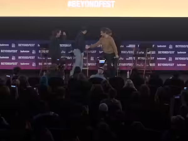 Nathan Fielder welcoming Tim Heidecker, Eric Notarnicola, and Gregg Turkington at the Mister America panel. (2019)