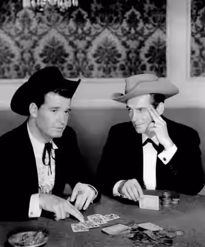 Photo of James Garner as Bret Maverick and Jack Kelly as Bart Maverick. The episode, titled "Hostage", was aired on November 10, 1957 and this was the introduct