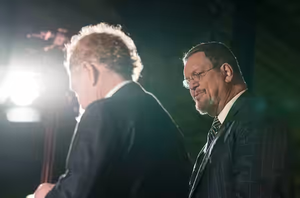 Magicians Penn and Teller perform for U.S. Airmen at the 2023 USO Holidays Tour at RAF Lakenheath, December 11, 2023. for 82 years, the USO has helped connect s