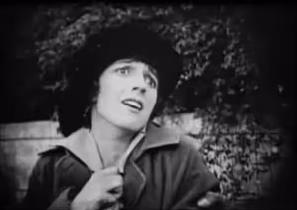 Low resolution screenshot from the public domain version of the film Intolerance (1916). A scene from the Modern Story of the film. The Friendless One (Miriam C