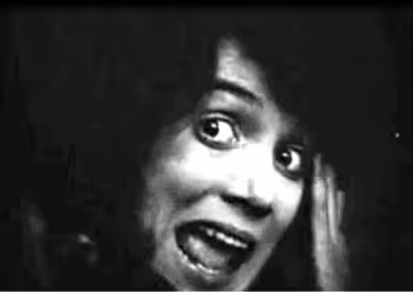 Low resolution screenshot from the public domain version of the film Intolerance (1916). A scene from the French Story of the film with Brown Eyes (Margery Wils
