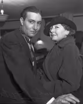 After a two year engagement Australian-born screen actress and writer Mae Busch files an intent to wed her fiancé Thomas C. Tate, who is employed as a civil eng (1936)
