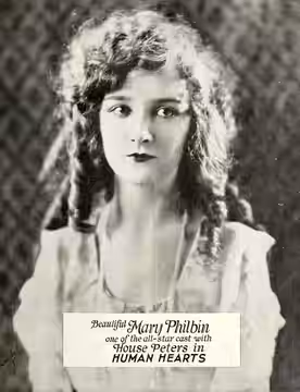 Still for the American film Human Hearts (1922) with Mary Philbin, on page 1 of the August 26, 1922 Universal Weekly.