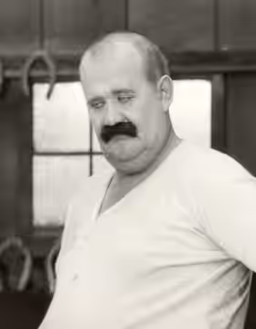 Joe Roberts in a detail from a scene still from the silent comedy "The Blacksmith" (1922). (2013)