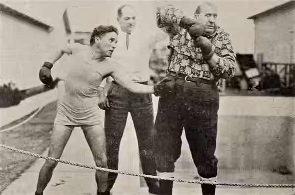 Charlie Chaplin, Kid McCoy, and Mack Swain, on page 32 of the February 16, 1924 Exhibitors Trade Review. There are several stills of Chaplin and Swain sparring 