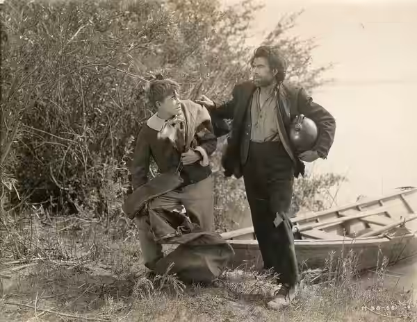 A scene from the American film Huckleberry Finn (1920) which played at the Coliseum Theater, Seattle. Date stamped June 29, 1920. Includes Lewis Sargent. Subjec (1919)