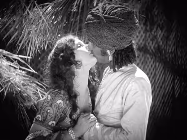 Actress Seeta Devi and Charu Roy kissing in the Indian silent film A Throw of Dice (1929).