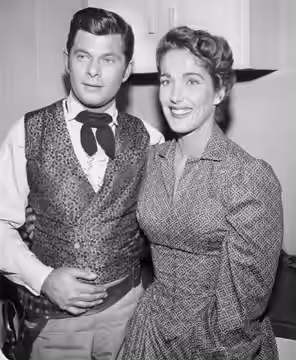 Photo of Dewey Martin and Julie Adams from the television program Frontier Justice. (1959)