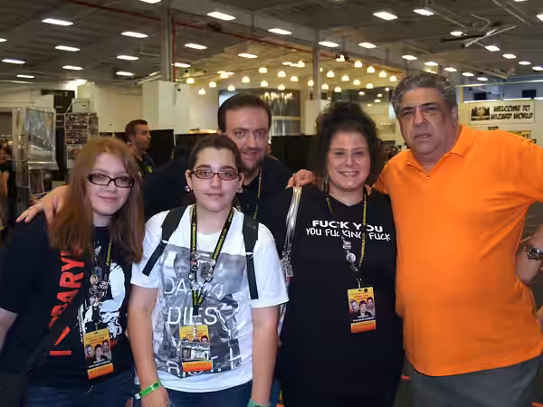 American actor Vincent Pastore (right) posing with a family of fans at the 2013 Wizard World New York Experience Comic Con, at Pier 36 in Manhattan, June 30, 20