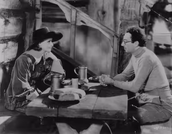 Greta Garbo and Rouben Mamoulian on the set of an American Pre-Code biographical film Queen Christina (1933).
