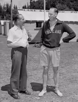 British oarsmen at the 1950 British Empire Games, coach of England's rowers J D Beresford (left) and competitor R D Burneil, standing outside the Lake Karapiro 