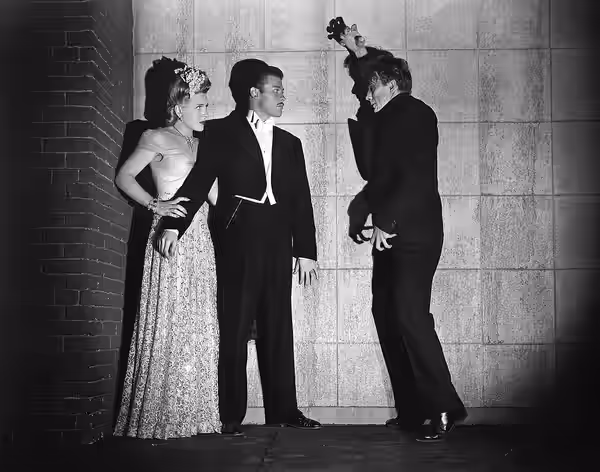 Left to right: Evelyn Ankers, Turhan Bey, and David Bruce in the film The Mad Ghoul (1943) - publicity still