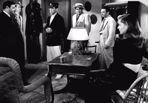 Promotional still from the 1944 film To Have and Have Not. Left to right: Dan Seymour, Aldo Nadi, Humphrey Bogart, Sheldon Leonard, Marcel Dalio and Lauren Baca