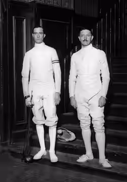 French Fencer Felix Ayat And Italian Aldo Nadi, Standing In Uniform At The Foot Of A Staircase, On January 26Th, 1926.