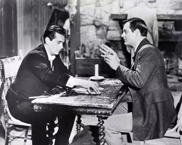 Photo of Jack Kelly (Bart Maverick) and Richard Long (Gentleman Jack Darby) from the television program Maverick.
