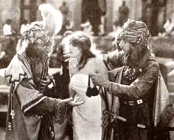 Still from the American fantasy film A Daughter of the Gods (1916) with Annette Kellerman and Stuart Holmes, the other male actor is not identified, on page 401 (1917)