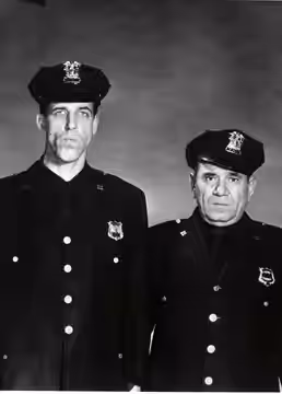 Photo of Fred Gwynne as Officer Muldoon and Joe E. Ross as Officer Toody from the television program Car 54, Where Are You?. (1961)