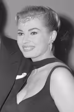 Anita Ekberg at the 30th Annual Academy Awards at the Pantages Theatre in Los Angeles to present the Oscar for achievement in music scoring. (1958)
