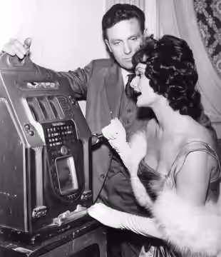 Publicity photo of Robert Stack as Eliot Ness and Gloria Talbott from the television program The Untouchables.