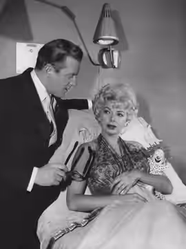 Photo from the television series The Twilight Zone. The episode is "Twenty-two"; pictured are Barbara Nichols and Fredd Wayne.