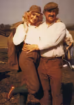 Photograph of Susie Silvey with Bernard Cribbins during filming of Cuffy (1980)