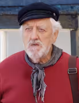 Bernard Cribbins during the filming of the CBeebies show Old Jack's Boat. Cropped from https://commons.m.wikimedia.org/wiki/File:Staithes_MMB_24_Old_Jack%27s_Bo (2012)