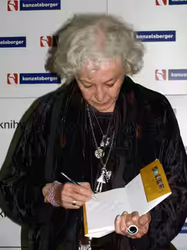 Czech actress Květa Fialová signing a copy of book about herself (2009)
