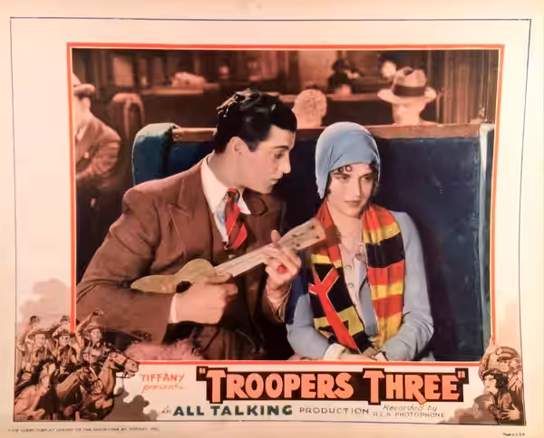 Lobby card for the American comedy film Troopers Three (1930). There are no copyright marks on the card. At lower left is This lobby display leased to the exhib