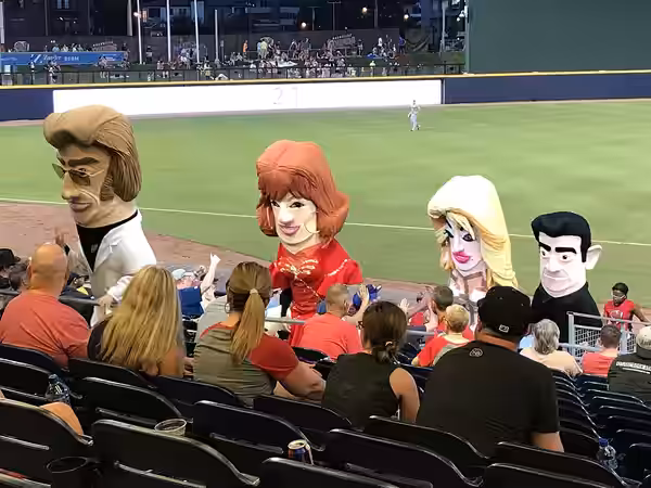 Caricature mascots of country musicians George Jones, Reba McEntire, Dolly Parton, andJohnny Cash, and after racing around First Tennessee Park during the fifth (2018)