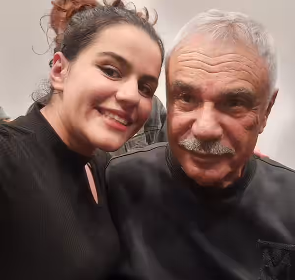 Halil Ergün posing with a fan