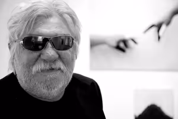 László feLugossy at his exhibition, April 2010, Sárospatak - the picture in the background is feLugossy's work, "Inscrutable" (2010)