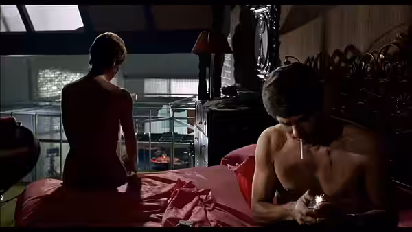 Jean Sorel and Elsa Martinelli in a scene from One on Top of the Other (1969).