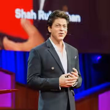 Someone here told me that SRK is the best known person in the world (news). His TED Talk is now online. This is a photo I took while he was speaking. P.S. I am  (2017)