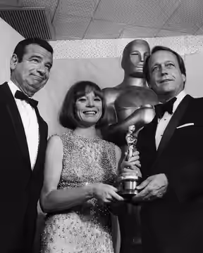 Walter Matthau, Shirley MacLaine and George Roy Hill in the 46th Academy Awards. The dress in the photo, created by Edith Head in 1963 and modified around 1966,