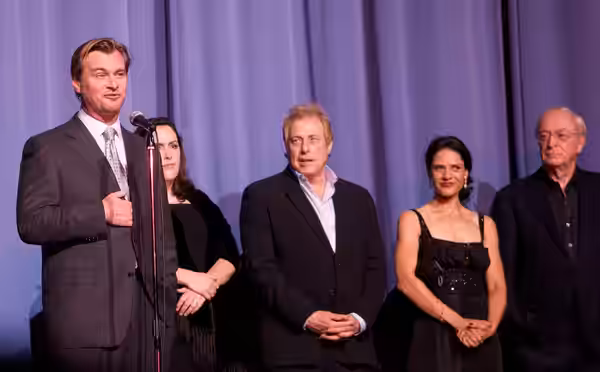 Cast and crew of The Dark Knight at the European premiere in London. From left to right: Director Christopher Nolan, producers Emma Thomas and Charles Roven, ac (2008)