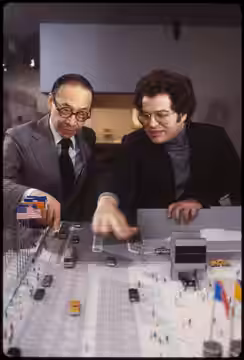 Itzhak Perlman with I.M. Pei, architect, looking at model of NYC Convention Center (1980)