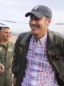 Jeremy Garelick, director and writer for the movie "The Wedding Ringer," puts on a custom pilot jacket at Marine Corps Air Station (MCAS) Miramar, San Diego, Ca (2015)