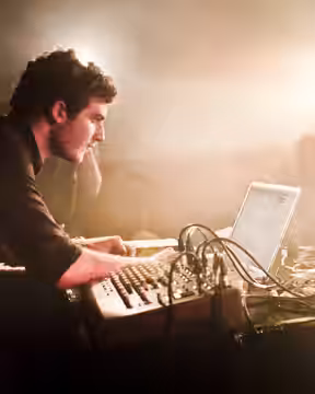 Nicolas Jaar playing live with his band at the Rex Club in Paris in April 2011.