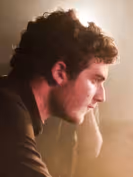 Nicolas Jaar playing live with his band at the Rex Club in Paris in April 2011.