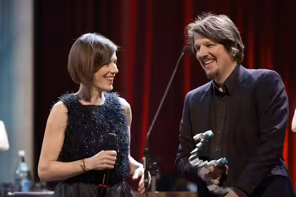 Pia Hierzegger, presenter of the Austrian Film Awards 2017, with Hannes Salat, winner for best scenic design (Stille Reserven); Rathaus, Vienna, Austria.