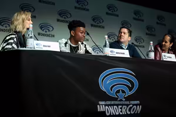 Olivia Holt, Aubrey Joseph, Joe Pokaski and Gina Prince-Bythewood speaking at the 2018 WonderCon, for "Cloak &amp; Dagger", at the Anaheim Convention Center in 